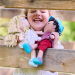 William soft doll box side by HABA USA