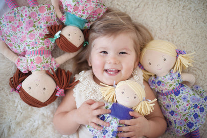 Lil'l Peggy soft doll standing by Tikiri Toys