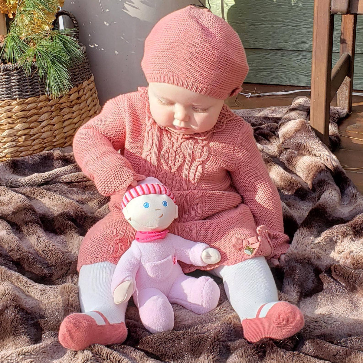 My First Snug Up Luisa baby doll sitting by HABA USA
