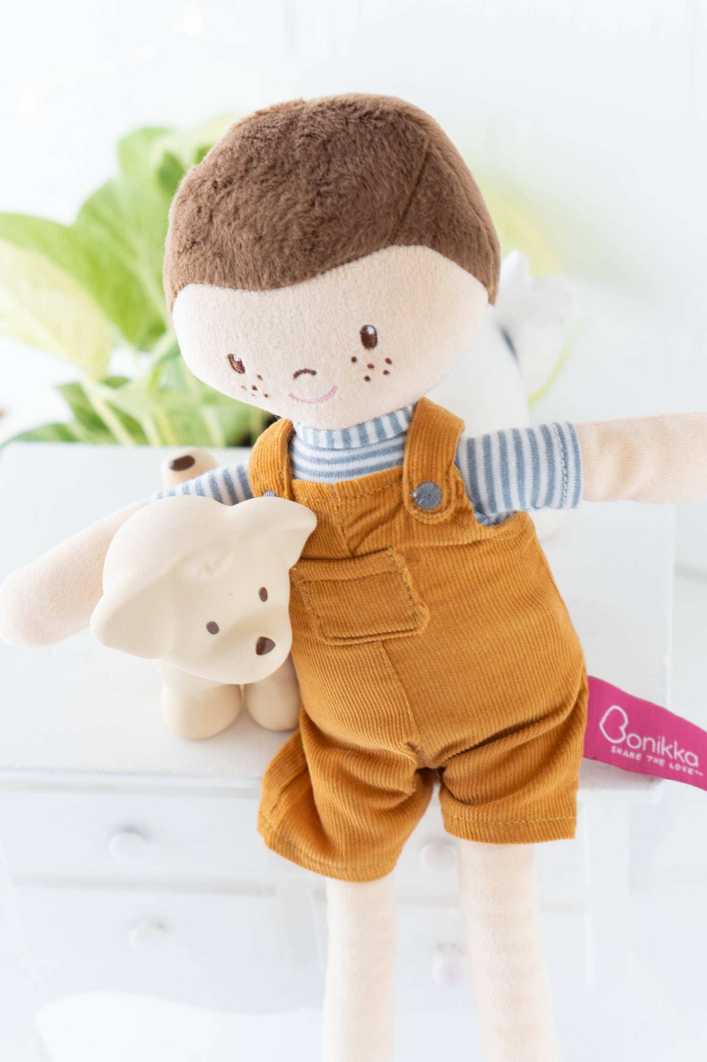 Tim soft doll sitting by Tikiri Toys