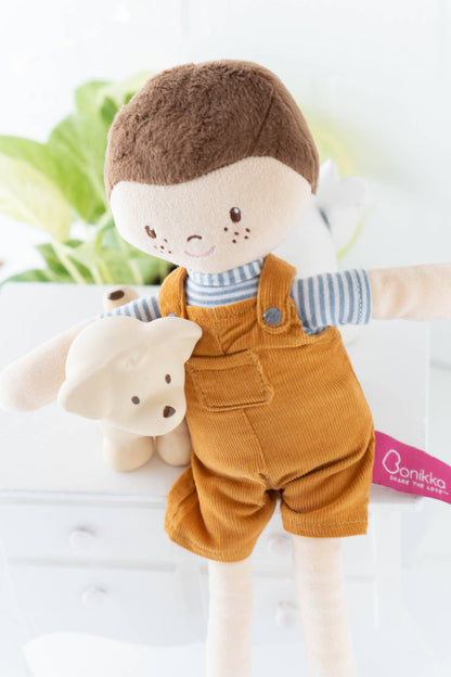 Tim soft doll sitting by Tikiri Toys
