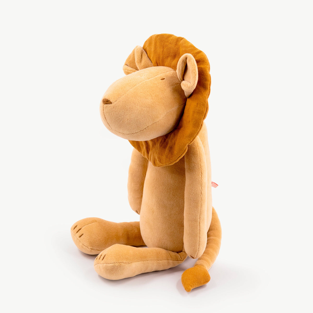 Plush lion toy on a white background