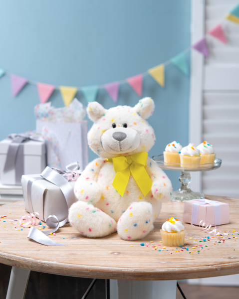 Sprinkles birthday bear styled on table by GANZ