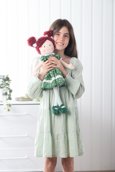 Shamrock doll Siobhan held by girl by GANZ