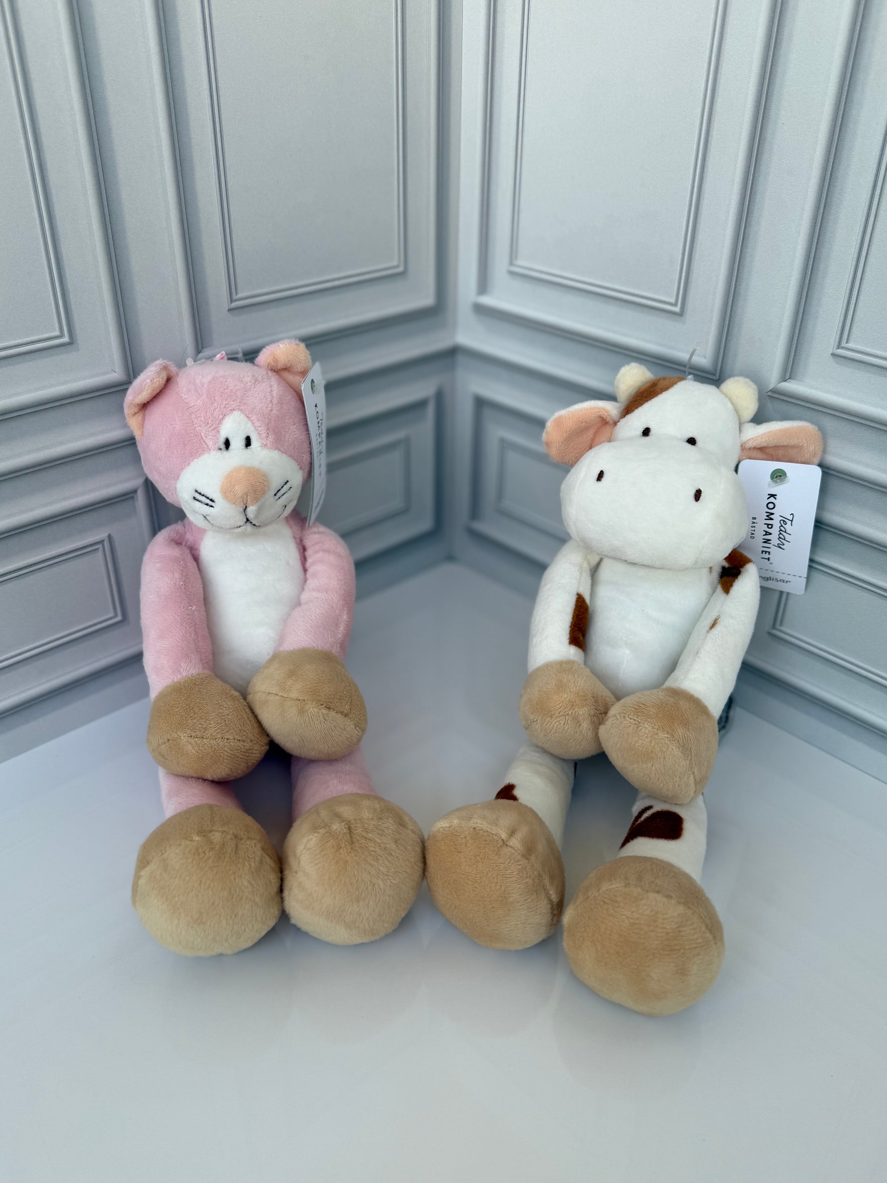 Pink cat plush toy side view