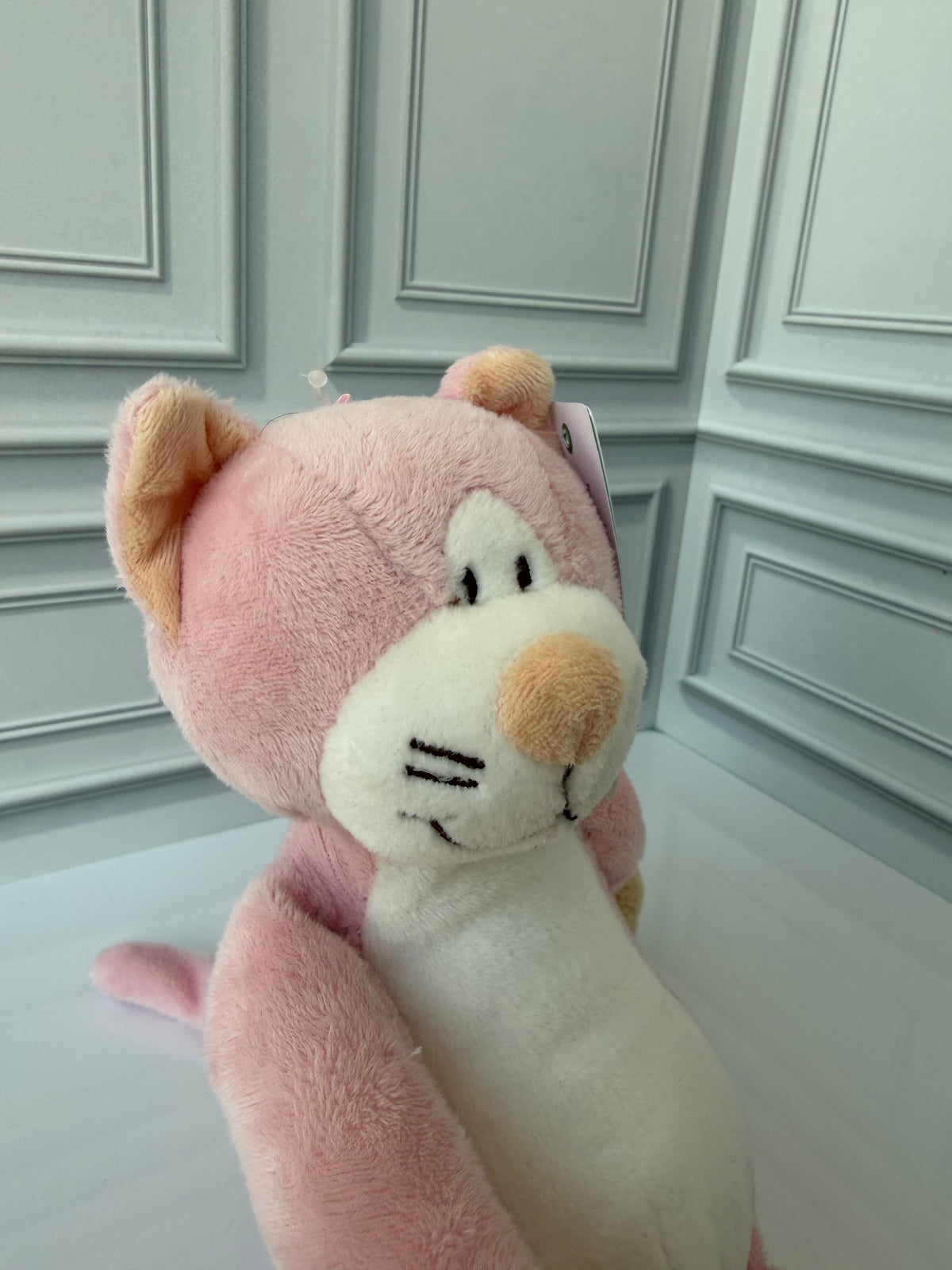 Pink cat plush toy close-up