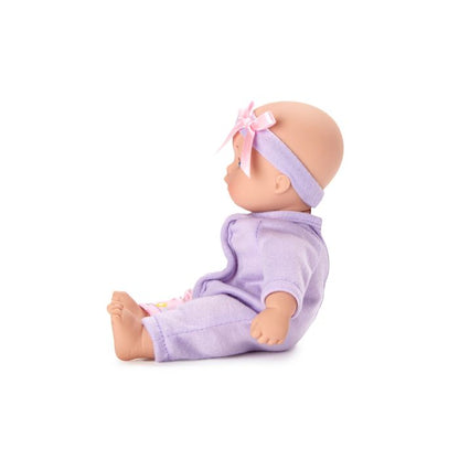 Little Cuties lavender baby doll sitting by Madame Alexander