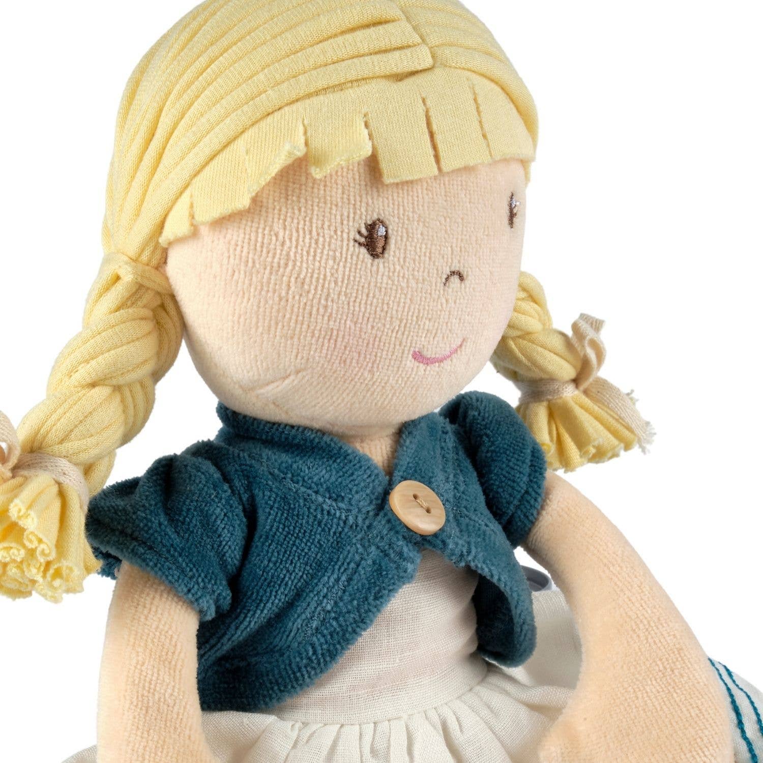 Lily organic doll sitting by Tikiri Toys